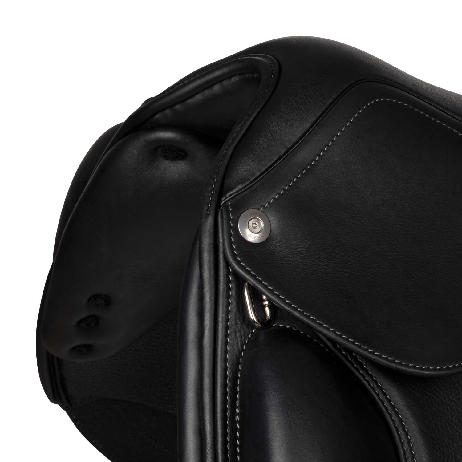 Close-up of a black leather saddle with a button on a white background